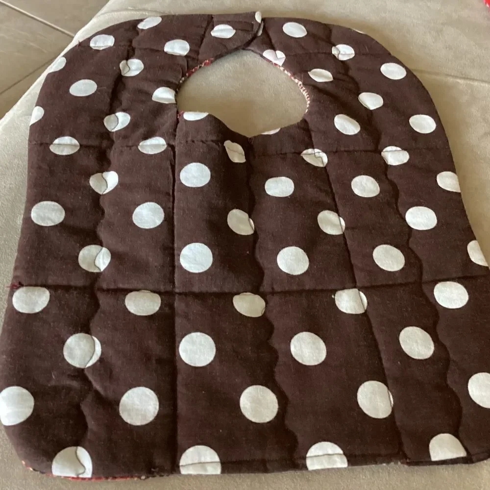 NWT. Hand, crafted baby bib in brown and green shirt plaids